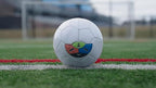 Soccer ball with KickMap Trainer visual strike guide applied on the field