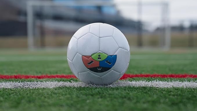 Soccer ball with KickMap Trainer visual strike guide applied on the field